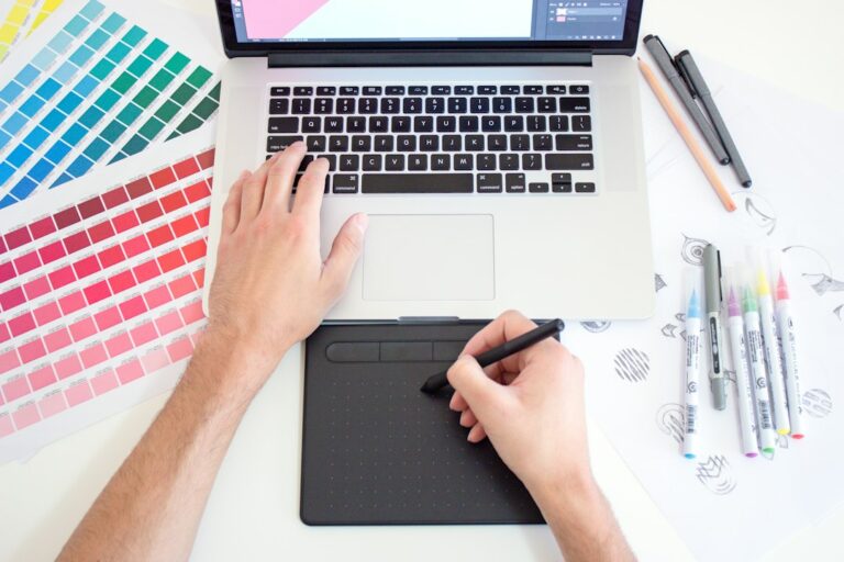 Creative professional building a digital product on a laptop, illustrating the choice between ready-made catalog products and creating original digital products