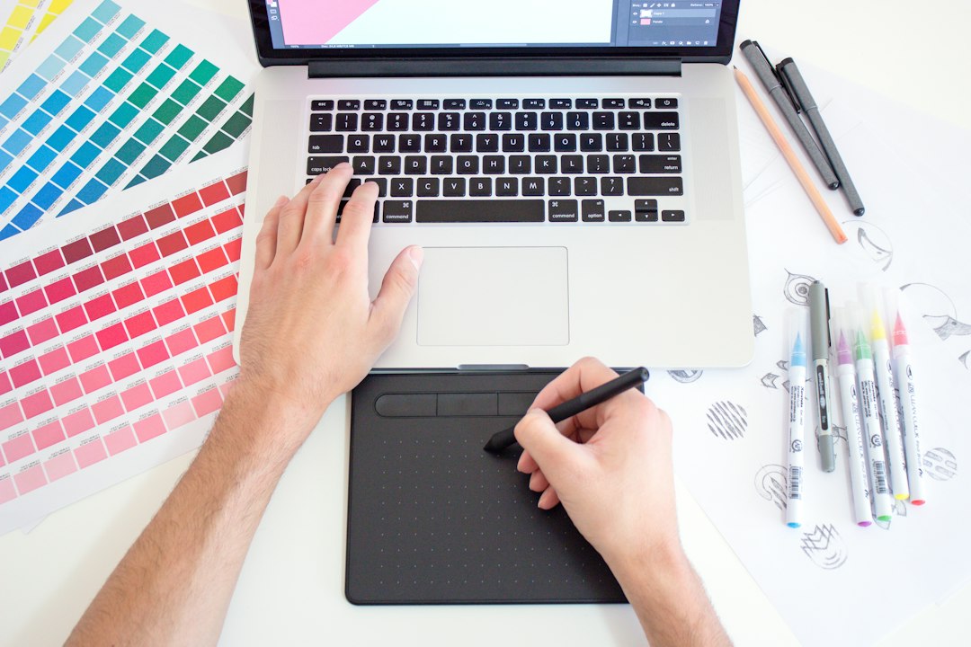 Creative professional building a digital product on a laptop, illustrating the choice between ready-made catalog products and creating original digital products